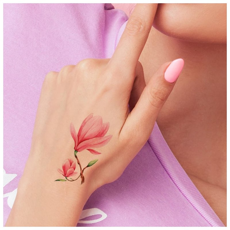 Delicate flower tattoo on the palm