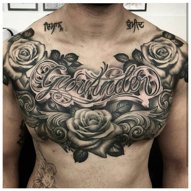 Flower theme tattoo on the chest of a man