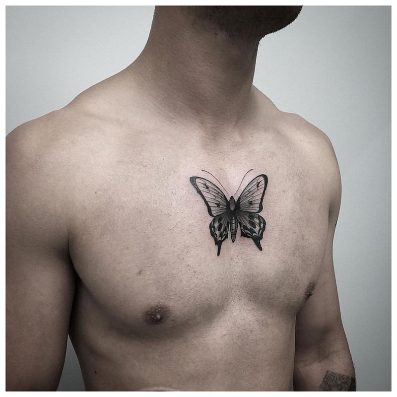 Butterfly tattoo on chest