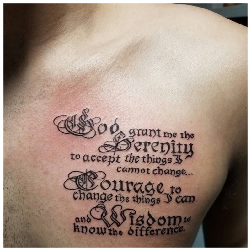 Tattoo inscription on the chest of a man