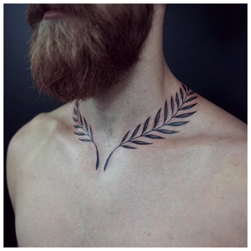 Tattoo 2 branches on the neck of a man