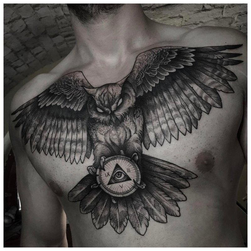 Bird tattoo on a man’s chest