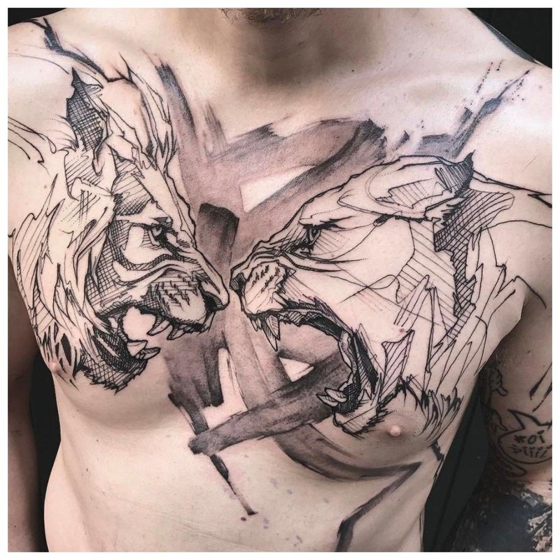 2 angry animals - a tattoo on a man’s chest