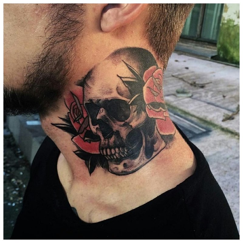 Old school - skull tattoo on the neck of a man