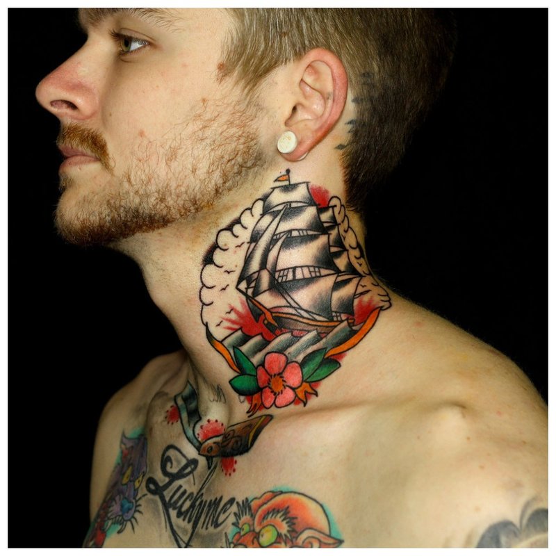 Bright tattoo on the neck and chest of a man