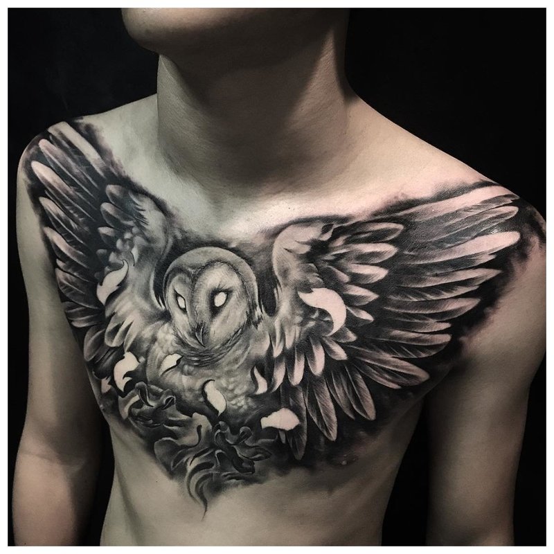 Wingspan of a bird - tattoo on a man's chest