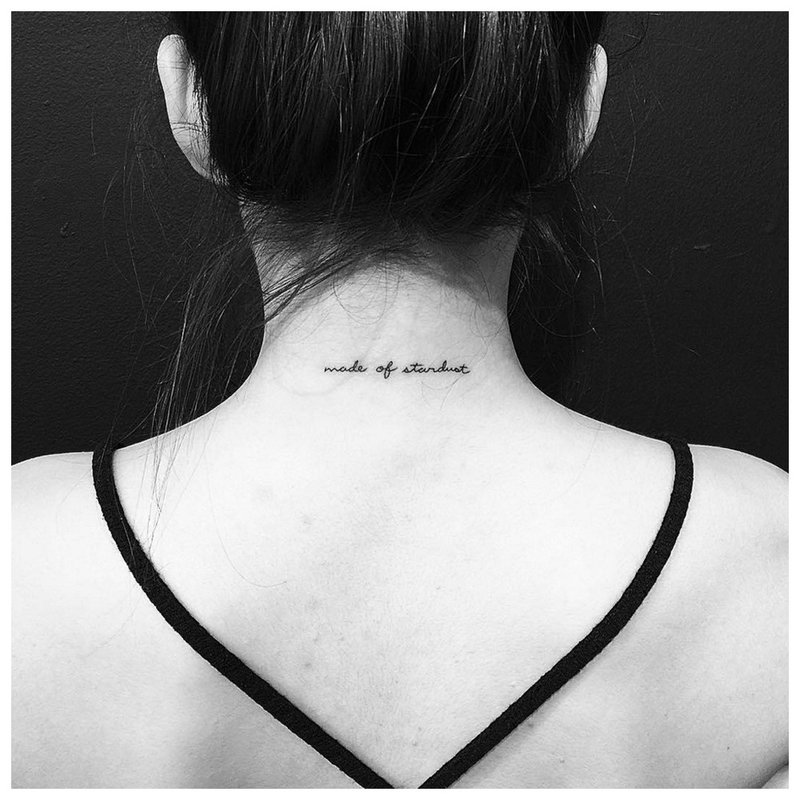 Tattoo inscription on the neck at the back