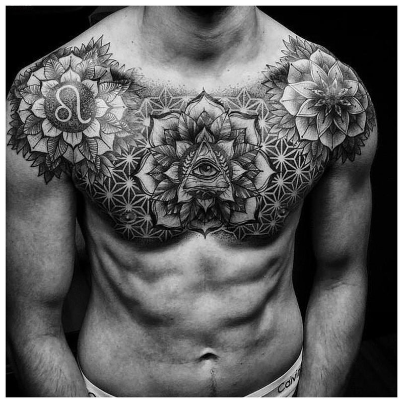 Large flower tattoo on the chest of a man