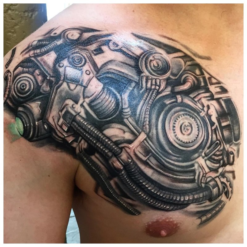 Cyberpunk style tattoo on the chest of a man