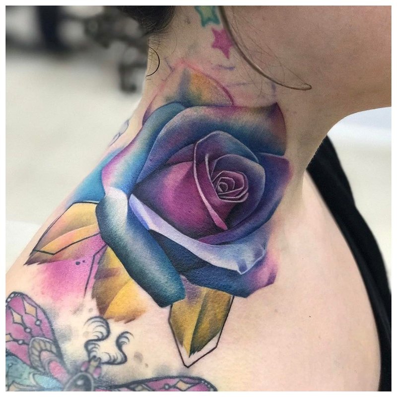 Bright flower - a tattoo on a girl's neck