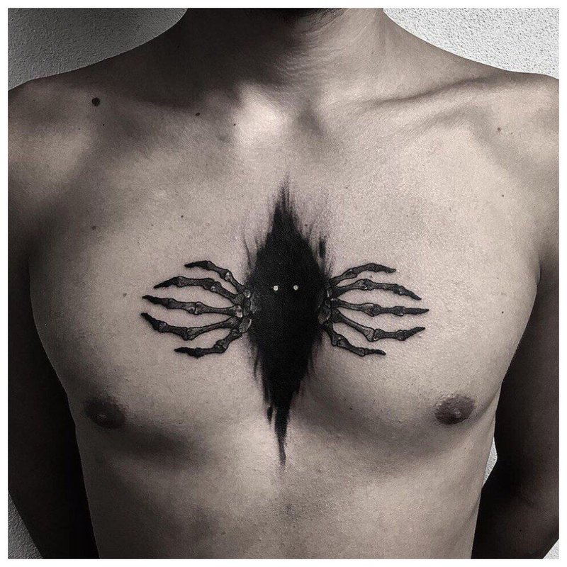 Scary spider - tattoo on the chest of a man