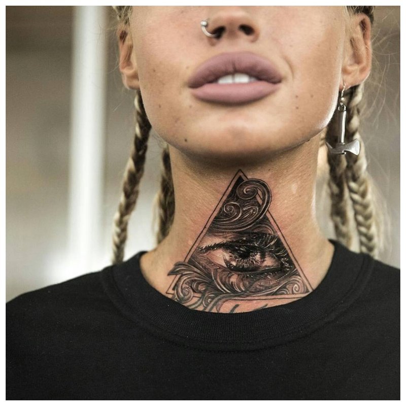 Tattoo on the throat of a girl