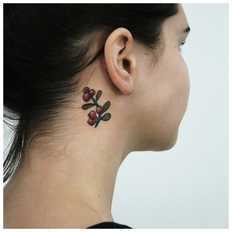 A little flower on the girl’s neck