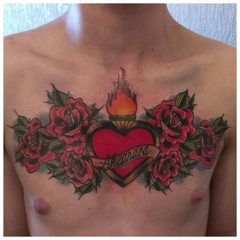 Bright flowers - a tattoo on a man’s chest