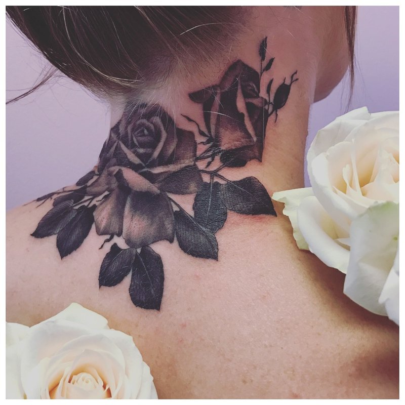 Large rose tattoo on the neck