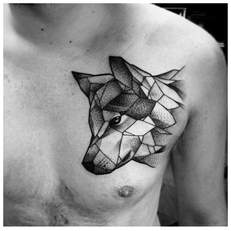 Tattoo of a wolf on a man’s chest