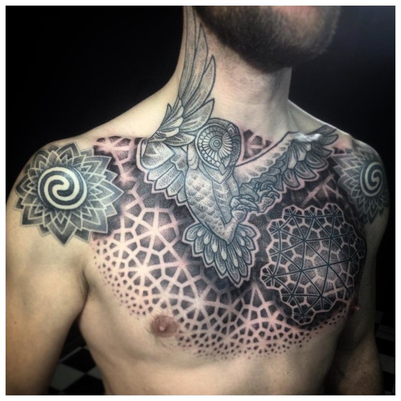 Unusual bird tattoo in the style of a do-it-yourself chest on a man