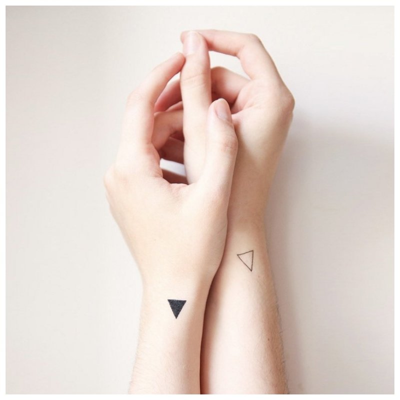 Paired tattoos on the hands