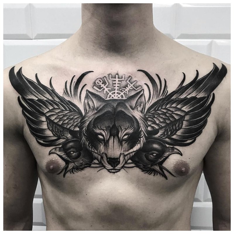 Animal theme tattoo on the chest of a man