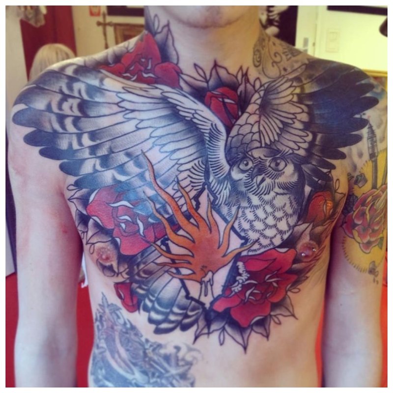 Floral tattoo on the entire chest and shoulders of a man