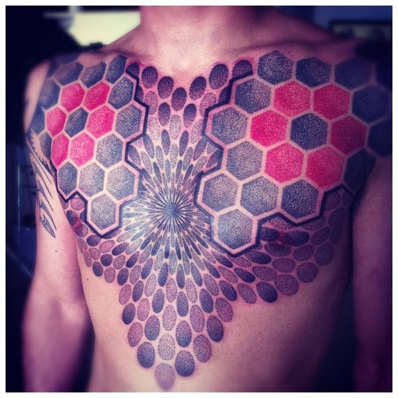 Bright tattoo on the chest of a man in the style of a do-it-yourself