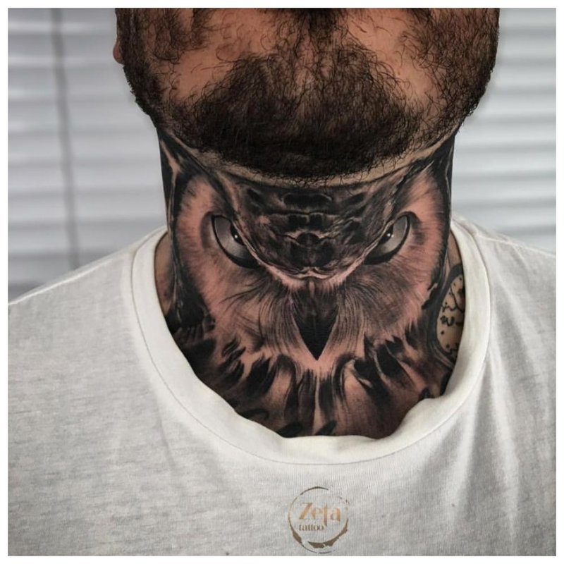 Tattoo owl on the neck of a man