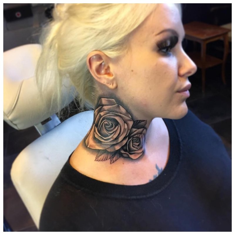 Large tattoo on the neck of a girl