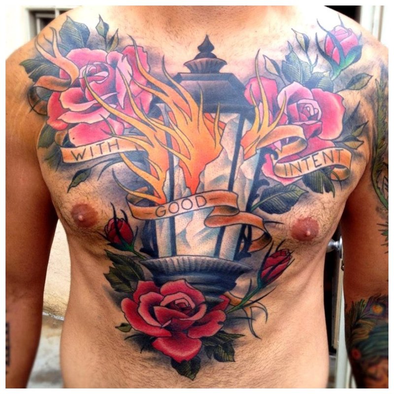 Bright large flowers - tattoo on the chest of a man