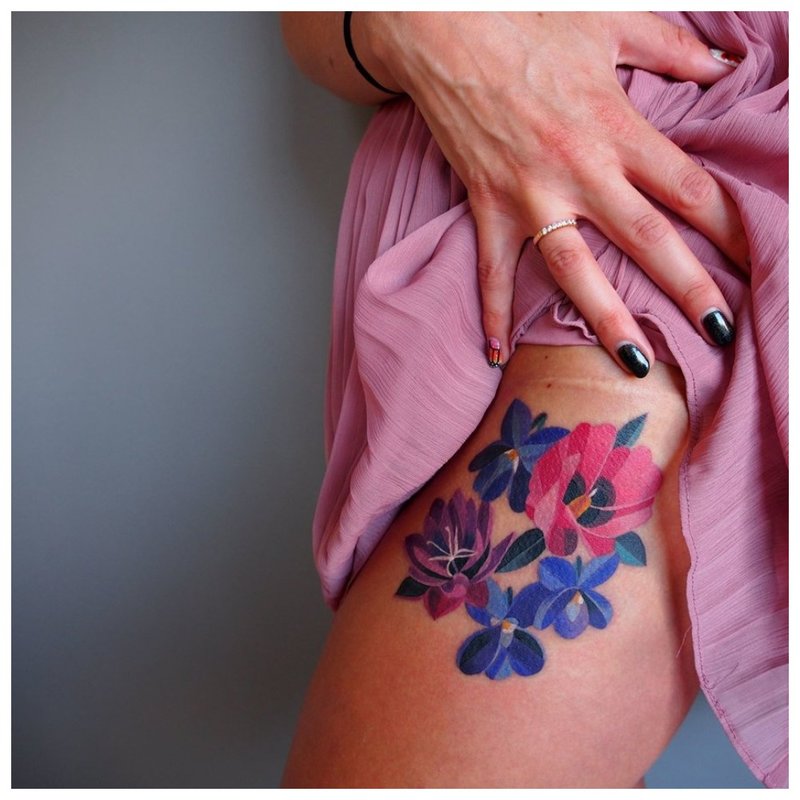 Watercolor flower tattoo on hip