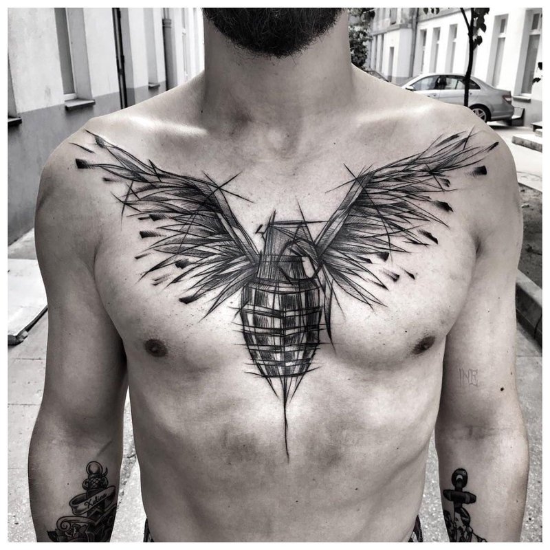 Bird - tattoo on a man's chest