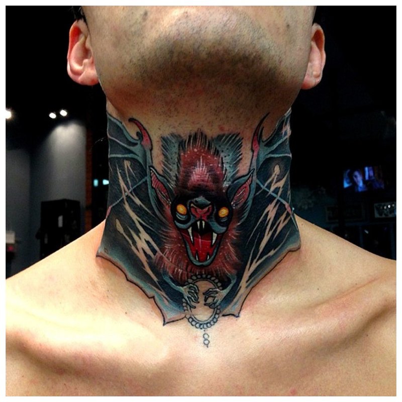 Tattoo on the throat of a man