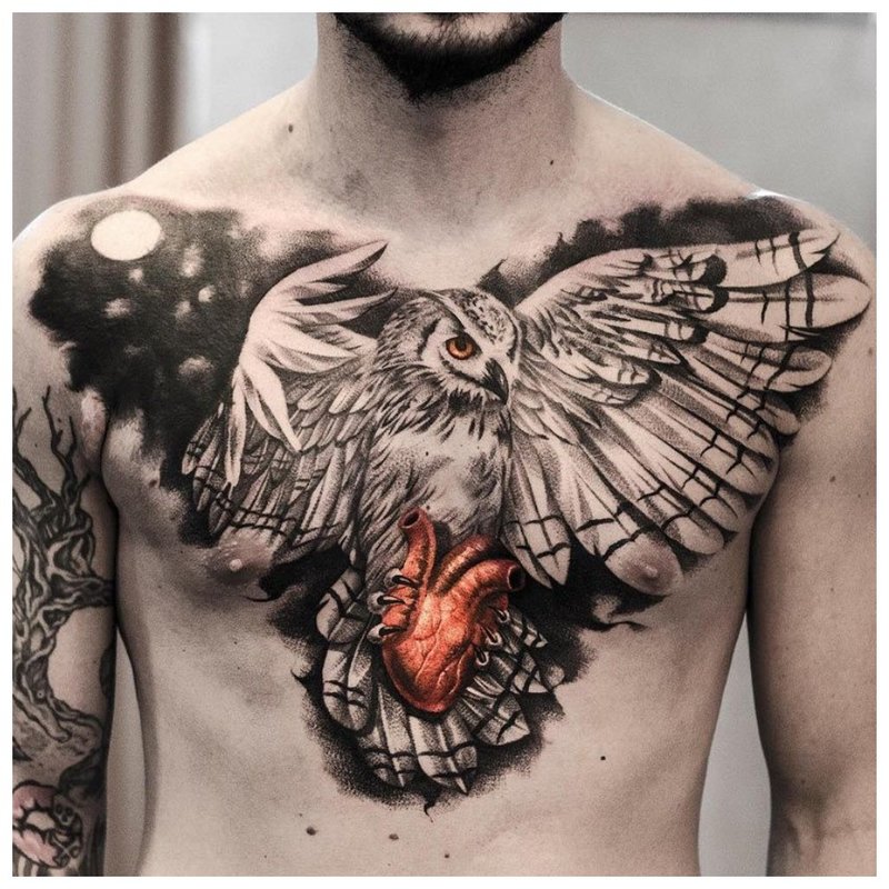 Bright tattoo on the chest of a man