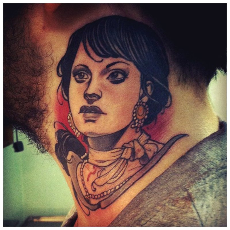 Tattoo portrait on the neck of a girl